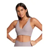 Top deportivo Under Armour Meridian Rib Bralette de color lila, confeccionado en tejido acanalado de punto con escote en V profundo y diseño alargado.