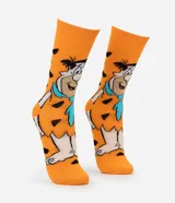 Medias de caña larga color naranja con estampado de Pedro Picapiedra. Confeccionadas en tejido de algodón con detalles en poliéster.