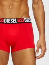 Boxer de algodón negro con cintura elástica ancha que presenta el logo de la marca Diesel en letras blancas y rojas.