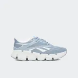 Championes Reebok Zig Dynamica 6 color celeste con detalles en blanco.