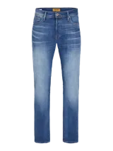 Jean de tiro alto, corte tapered, color azul denim, con cinco bolsillos y cierre con botón.