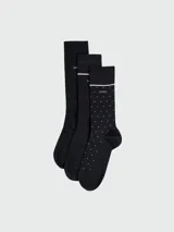 Pack de tres pares de medias de caña media marca Boss. El set incluye dos pares lisos en color negro y un par negro con estampado de lunares pequeños y detalle de línea horizontal en el puño.