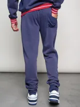 Pantalón de jogging rojo con puños, efecto lavado y escudo del Club Nacional de Football bordado.