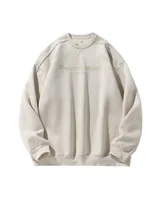 Buzo de cuello redondo estilo oversize en color beige, con textura afelpada tipo gamuza suave y estampado frontal con la leyenda "Magisterial Master The Youth".