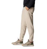 Pantalón de jogging color beige, confeccionado en mezcla de algodón, con cintura elástica ajustable mediante cordón, bolsillos laterales y bolsillo trasero. Presenta puños acanalados en los tobillos y un pequeño parche con el logo de la marca en la parte frontal.