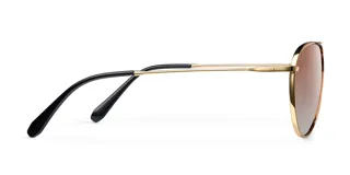 Lentes de sol estilo aviador con montura metálica fina en color dorado y lentes degradadas en tono marrón. Presentan un diseño ligero con puente doble y terminales de patillas en acetato.