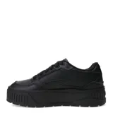 Championes Puma modelo Karmen II Idol, color negro con detalles dorados. Diseño de plataforma con parte superior de cuero y plantilla SoftFoam+ para mayor amortiguación.