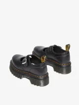 Zapato mocasín negro de cuero Nappa Lux con plataforma Quad Neoteric, suela con tacos profundos y pespunte amarillo.