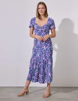 Vestido largo estampado con escote en V, corte bajo el busto, cintura elastizada y espalda en punto smock.