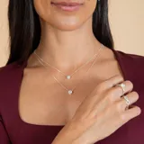Conjunto de dos collares con dije punto de luz en plata 925 y circonia, con cadena de eslabones finos.