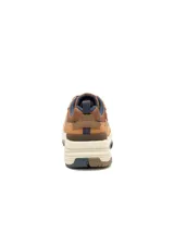 Sneaker Caterpillar modelo Grapple Leather para hombre, fabricado en cuero marrón con detalles en tonos tostados y azul oscuro, con suela dentada y entresuela de EVA.