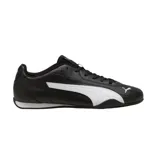 Championes Puma modelo Catch, de diseño deportivo en color negro con la característica franja lateral en blanco y logo de la marca en la puntera y lengüeta.