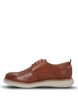 Zapato de cuero Hush Puppies modelo Rustic, color marrón tostado, con cordones y suela de EVA gris claro.