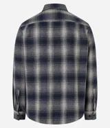 Camisa de franela a cuadros azul marino y beige, de corte comfort, con cuello inglés, abotonadura frontal, manga larga y bolsillo en el pecho.