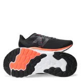 Championes de running New Balance modelo Fresh Foam Arishi V4, color negro con detalles en naranja y blanco. Presentan una parte superior de malla transpirable con refuerzos sintéticos y de gamuza, entresuela con tecnología Fresh Foam para mayor amortiguación y suela de goma resistente.