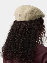 Gorra tipo boina clásica de algodón en color beige, con diseño estructurado y visera corta.
