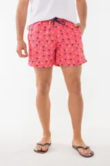 Short de baño azul con estampado de flamencos.