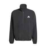 Campera deportiva Adidas de hombre, color negro, con cierre frontal y cuello alto. Presenta el logo Badge of Sport de Adidas en blanco en el lado izquierdo del pecho. Tiene puños y cintura elásticos.