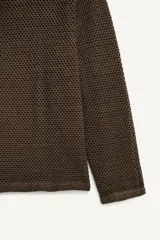 Cárdigan de punto con tejido de crochet en mezcla de algodón, de corte relajado, cuello en pico y cierre frontal con botones.