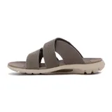 Sandalia de hombre color kaki/marrón topo, con tiras cruzadas de material sintético con perforaciones y costuras visibles. Suela gruesa y ergonómica en tono beige claro.