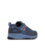 Championes de senderismo Columbia modelo Peakfreak II OutDry, color azul con detalles en naranja y gris oscuro. Presentan una construcción de malla sin costuras con tecnología impermeable OutDry, sistema de ajuste Navic Fit, entresuela TechLite+ para amortiguación y suela Adapt Trax para tracción en diversos terrenos.