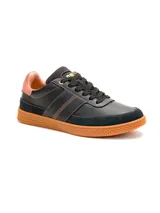 Sneaker Caterpillar modelo Pause Retro para mujer, de color negro con detalles en salmón y suela de goma marrón con textura de panal.