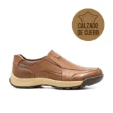 Zapato casual marrón de cuero, sin cordones, con elásticos laterales y suela de goma.