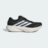 Championes de running Adidas Supernova Rise 3, color negro con las tres tiras laterales en blanco y mediasuela de amortiguación Dreamstrike+ en tono crema. Confeccionados con exterior de tela técnica Primeweave y suela de caucho Lighttraxion.