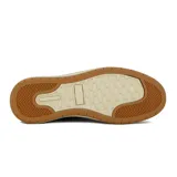 Zapato acordonado de cuero azul marino con cierre lateral, suela color crema y detalles en cuero marrón en el talón.