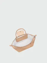 Bolso de mano tipo tote de la línea Le Pliage One de Longchamp, en color beige, con diseño minimalista y estructura flexible.