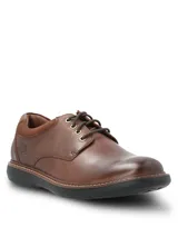 Zapato de cuero marrón con cordones, diseño clásico con costuras reforzadas y suela de goma EVA negra.