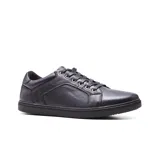 Zapato casual de cuero color marrón con cordones y suela blanca.