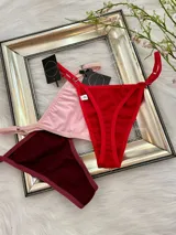 Pack de seis tangas de algodón con breteles regulables, disponibles en colores negro, blanco, champagne, rosa, bordo y rojo.