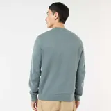 Sweater de punto de cuello redondo con puños y ruedo acanalados, de diseño clásico y corte estándar.