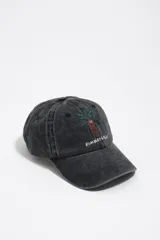Gorra gris oscuro con efecto lavado, con diseño bordado de una palmera y el texto 'Bimba y Lola' en la parte frontal.