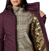 Campera Columbia Joy Peak II con tecnología Omni-Heat Infinity, aislamiento sintético Thermator y acabado repelente Omni-Shield. Presenta diseño acolchado, cuello alto forrado en felpa, cierre frontal completo, bolsillos laterales con cierre y puños con orificio para pulgar.