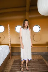 Vestido largo tejido en hilo de algodón con calado, color negro con detalles en celeste y naranja.