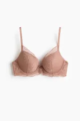Soutien push-up de encaje con aros y copas acolchadas que realzan el busto, con tirantes ajustables.