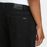 Jeans Volcom modelo Billow Denim de corte holgado y diseño de pernera ancha, en color negro.