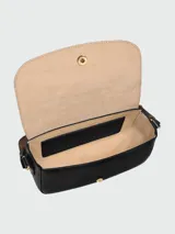 Bandolera Longchamp modelo Épure Timeless, color negro con correa de hombro ajustable de lona marrón. Presenta solapa con cierre de botón metálico dorado grabado y detalle del logo en relieve.
