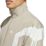 Campera rompevientos adidas Originals Basketball, de diseño urbano en color beige con paneles frontales y laterales en blanco, cuello alto y cierre frontal con cremallera. Incluye el logo del trébol bordado en el pecho.