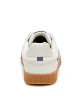 Sneaker Caterpillar modelo Pause Retro, de diseño minimalista con exterior en lona blanca y detalles en gamuza. Presenta suela de goma color caramelo con textura de panal y logo de la marca en el lateral y la lengüeta.