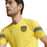Camiseta de fútbol amarilla de entrenamiento del Club Atlético Peñarol, marca Puma, temporada 2022.