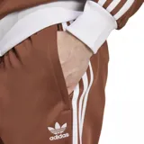 Pantalón de jogging marrón con cintura elástica y logo de Adidas bordado en blanco.