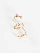 Set de tres anillos dorados con formas onduladas y diseño irregular. Uno de los anillos presenta un diseño de cadena.