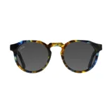 Lentes de sol Indie, modelo Honey Havana, con montura redonda de acetato con estampado multicolor y lentes grises polarizadas.