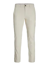 Pantalón chino slim de tiro medio en color beige, con cierre de cremallera y bolsillos laterales, confeccionado en tejido con algodón y elastano.