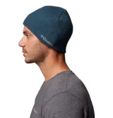Gorro de punto tipo beanie de la marca Columbia, en color azul, con diseño de tejido acanalado y logo de la marca bordado en el lateral.