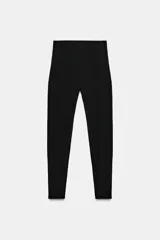 Leggings negros de tiro alto con cintura elástica, confeccionados en mezcla de poliamida.
