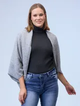 Cardigan de tejido suave con frente abierto y mangas amplias de corte holgado.